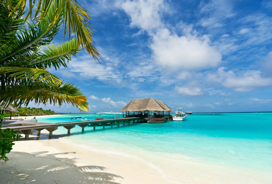 footbridge connecting with the thatched jetty in maldives