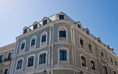 Fototapeta premium Old Angled Grey Building Under Blue Sky