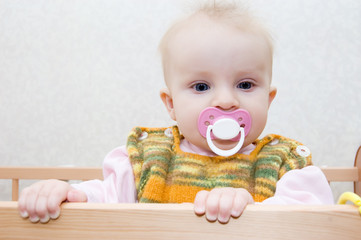 Cute baby girl with dummy