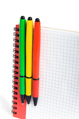 Three color ball pens and notebook