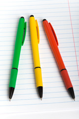 Three color ball pens and notebook