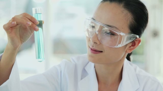 Female Researcher Holding a Test Tube