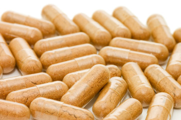 Heap of pills isolated on white background