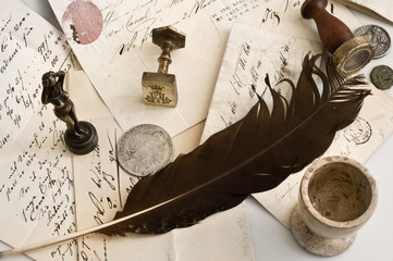 background with old letters,stamps and feather