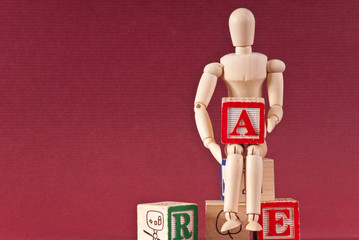 Wooden Art Maniquin Holding Letter A Block