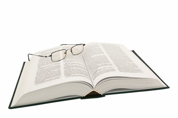 Open book with glasses.