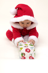 Portrait of Baby Opening Present
