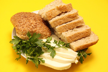 bread, cheese and parsley on plate