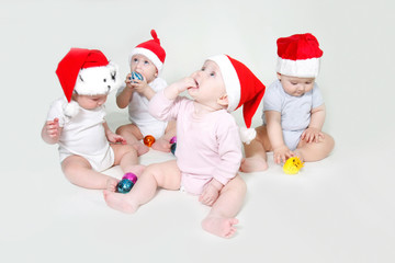 group of santa babies looking up