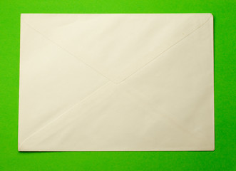 Envelope isolated on green