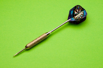 Darts arrow isolated on green background