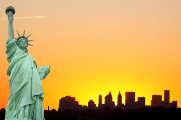 New York City Skyline and The Statue of Liberty at Sunset