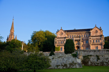 Palace of Sobrellano and church at sunset. Comillas, Santander