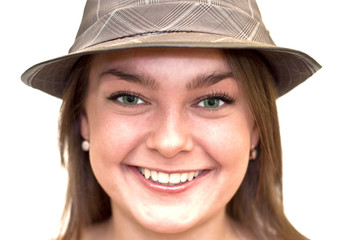 Beautiful young woman with green eyes wearing a hat.