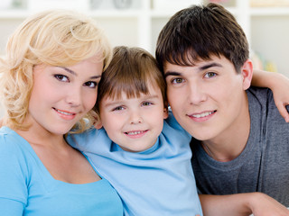 Happy smiling family with son