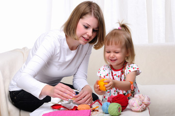 Young mother and her baby daughter