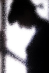 woman behind the glass