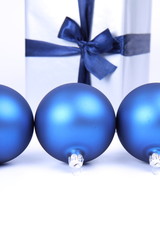 Blue matt christmas balls and gift-background with text space