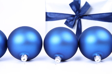 Blue matt christmas balls and gift-background with text space