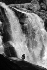 Hiker near waterfall in Kings Canyon National Park