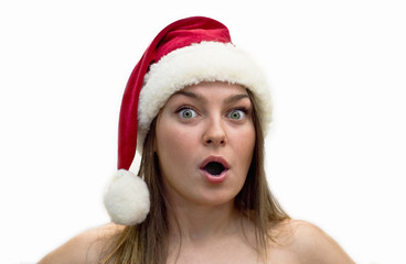 Surprised young women in a Santa Claus hat.