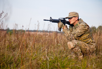 Fototapeta premium Soldier with a rifle
