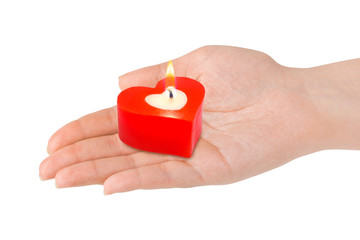 Heart shaped candle in hand