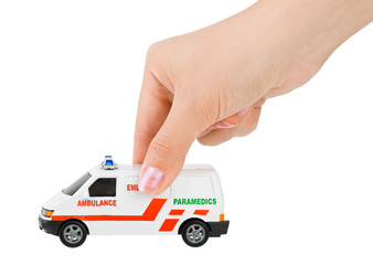 Hand with toy ambulance car © Nikolai Sorokin