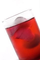 dewy glass of juice with ice