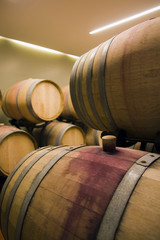 cap and the wine barrel in cellar