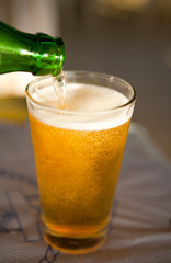 Pouring beer into glass