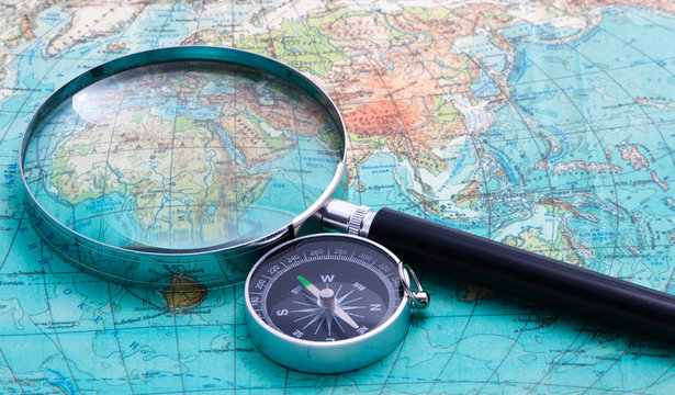 compass and magnifying glass