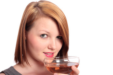 Beautiful young woman sipping champagne