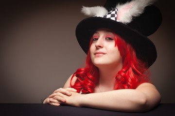 Sophisticated Red Haired Woman Wearing Bunny Ear Hat