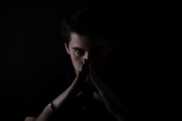 Obraz premium portrait of a young man in the darkness