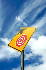 Stop sign ahead with @ symbol