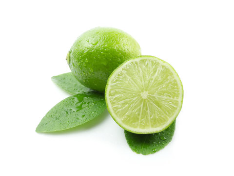 Green lemon with leaves on white background