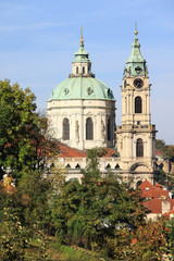 Fototapeta na wymiar View on the autumn Prague St. Nicholas' Cathedral