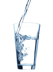 Pouring water into glass isolated on white background