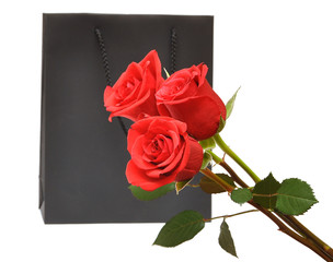 black gift bag with red roses
