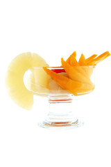 Fototapeta na wymiar tropical fruits within small glass cup