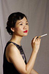 Obraz premium woman smokes in studio