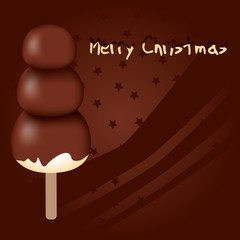 merry christmas - chocolate snowman on the brown background