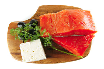 fresh smoked salmon on white plate with white cheese