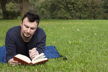 Young Adult Reading at the Park