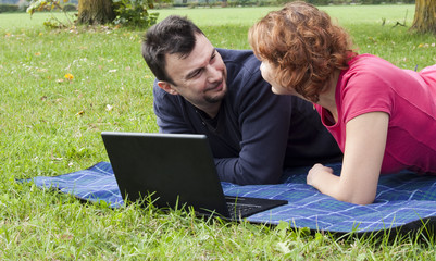 Young Adult Couple Relaxing in the Park