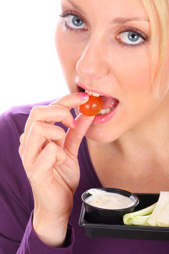 Young Woman Eating Crudites With Dip. Model Released