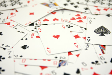 ace of hearts in a middle of cards. very shallow DOF