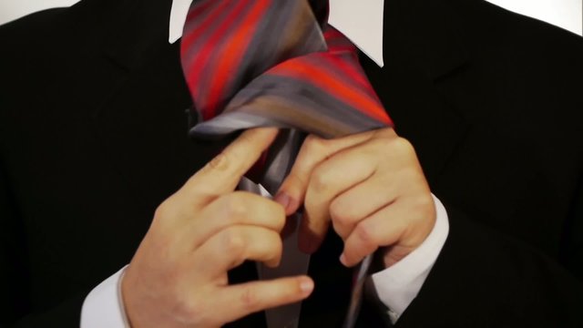 Male Tieing his Tie