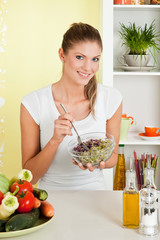 Beauty, young girl holding a bowl of salad